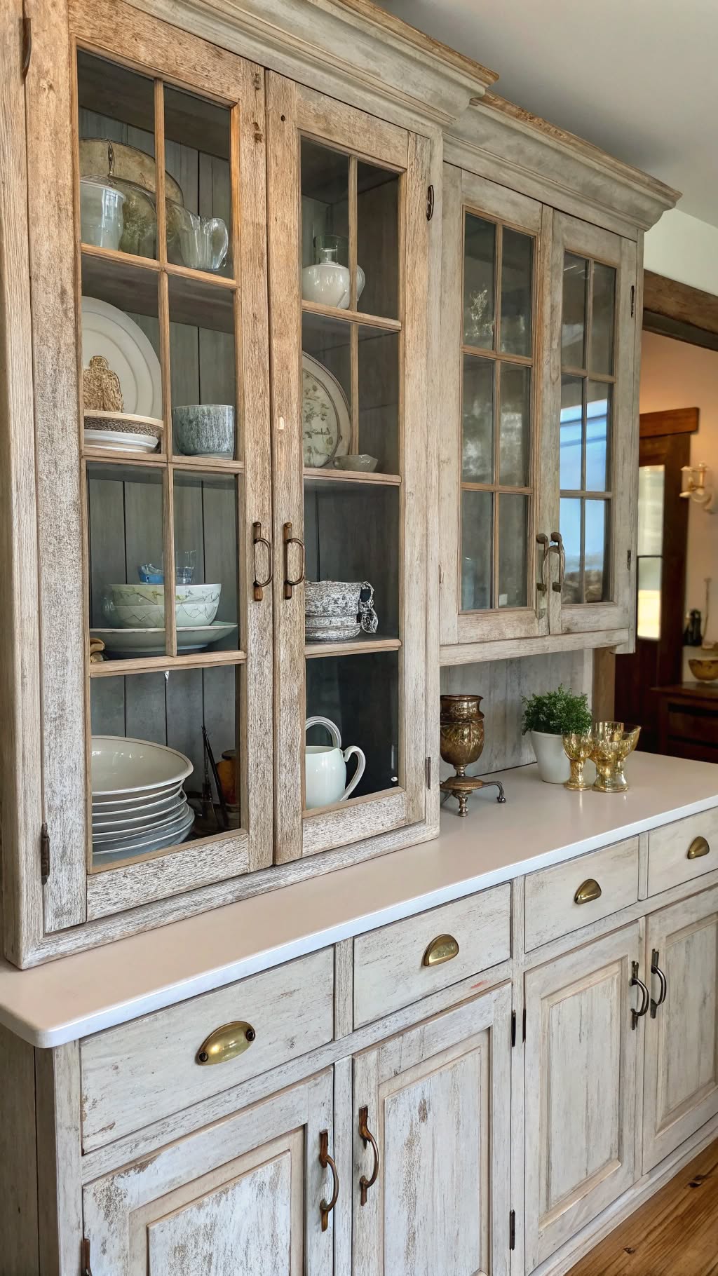 3. Distressed Wooden Cabinets with Glass Inserts