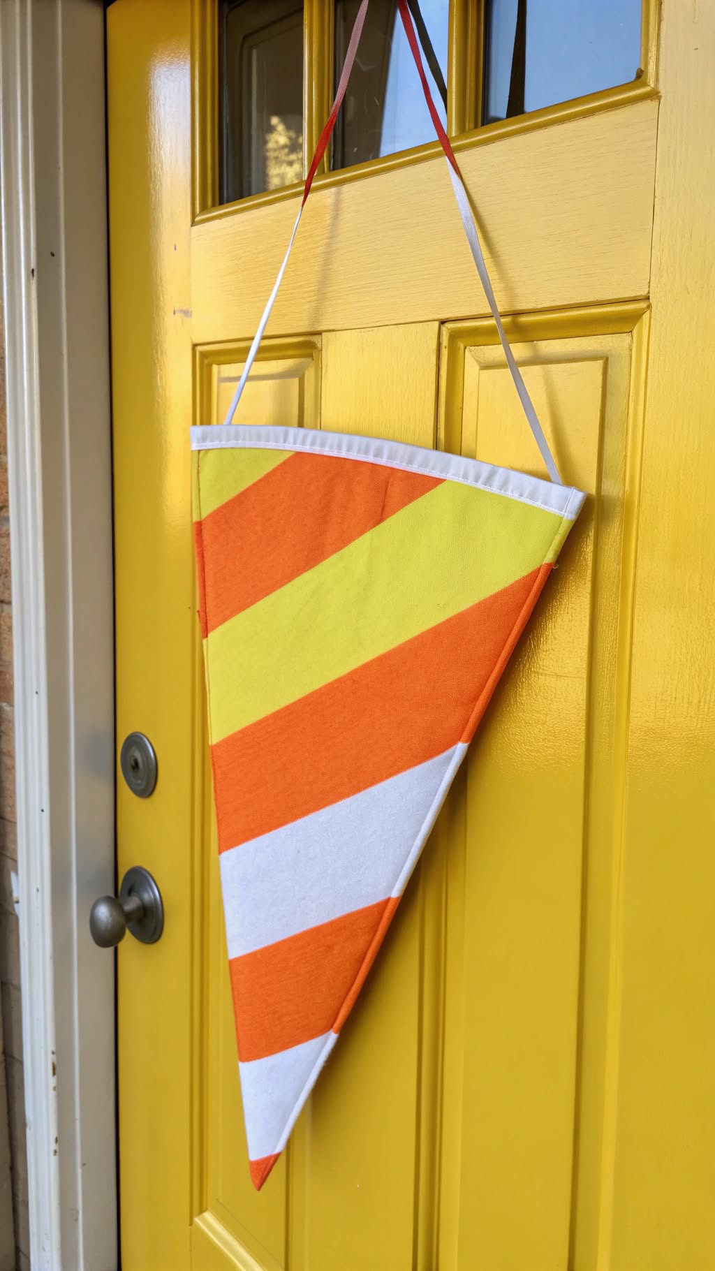 12. Candy Corn-Themed Door Hanger