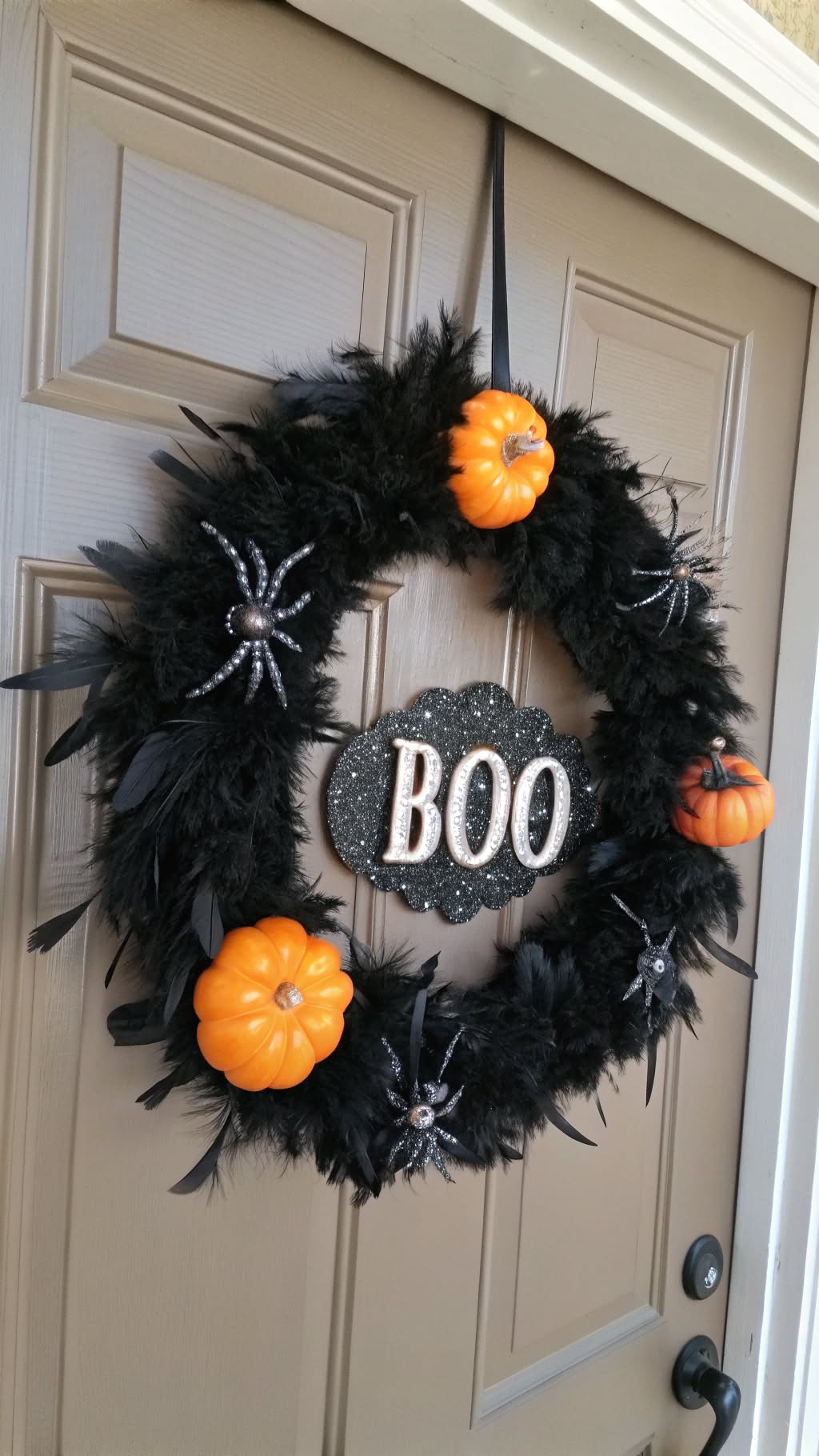 13. Halloween-Themed Wreath with Black Feathers
